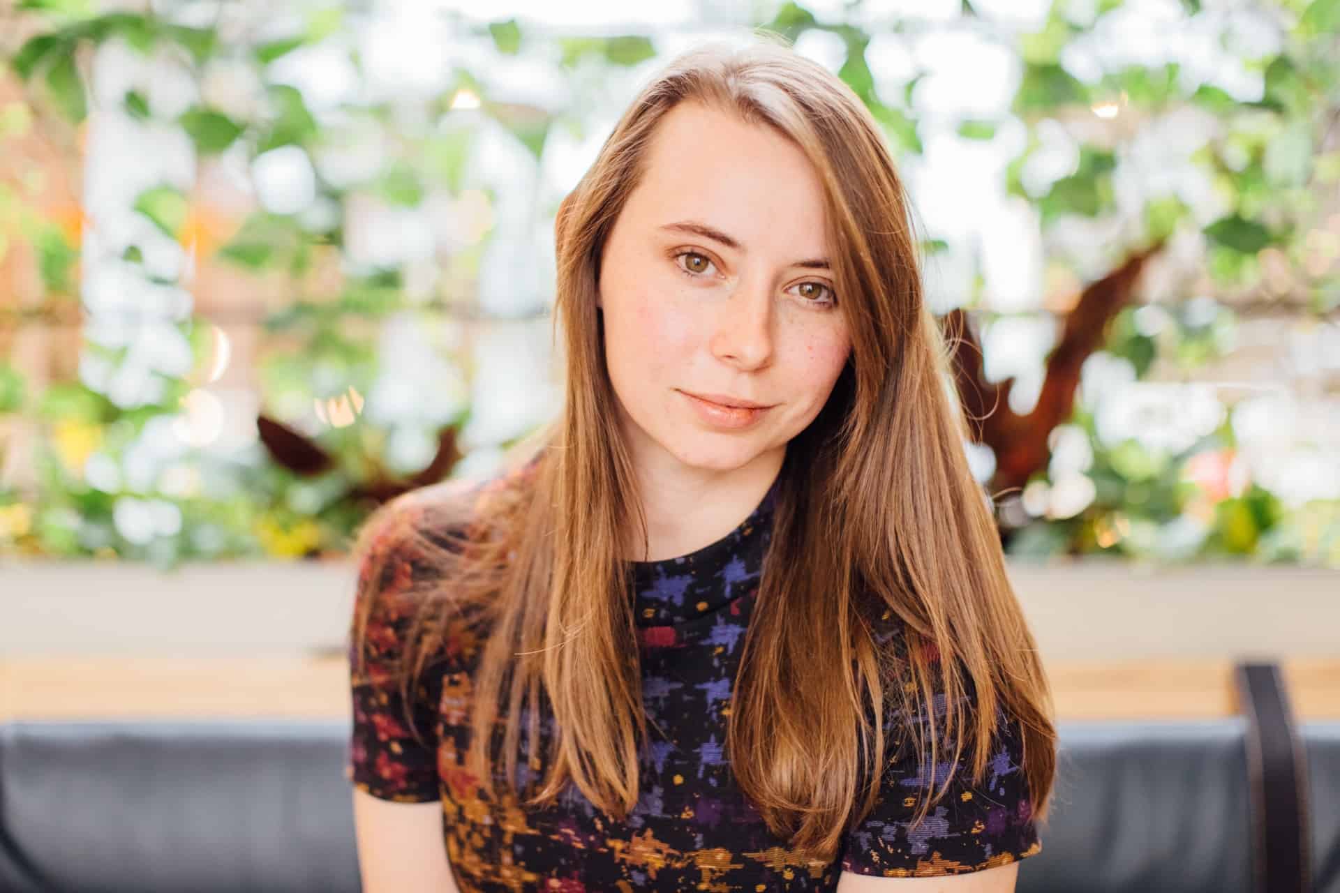 Lifestyle portrait of Brandie Neagles at a co-working space in Bentonville, Arkansas